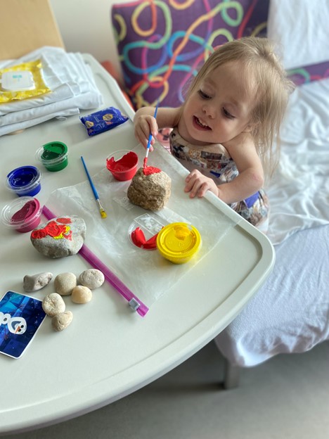 Madi painting a rock.jpg